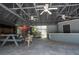 View of the cabana interior with picnic table, ceiling fans, and outdoor bar at 2110 Churchill Downs Cir, Orlando, FL 32825