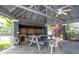 The pool cabana provides a picnic table, outdoor grill, and plenty of shaded area at 2110 Churchill Downs Cir, Orlando, FL 32825