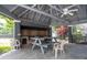 The pool cabana area features a picnic table, ceiling fans, and outdoor grill at 2110 Churchill Downs Cir, Orlando, FL 32825