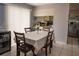 Inviting dining area with neutral tones, tiled floor, and wine cooler for intimate gatherings at 2110 Churchill Downs Cir, Orlando, FL 32825
