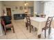 Cozy dining space flowing into the living area, enhancing the open floor plan at 2110 Churchill Downs Cir, Orlando, FL 32825