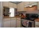 Functional kitchen with a seamless view into the adjacent dining and living spaces at 2110 Churchill Downs Cir, Orlando, FL 32825
