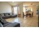 Spacious living room with dining area and access to the kitchen, ideal for entertaining at 2110 Churchill Downs Cir, Orlando, FL 32825