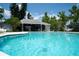 The community pool offers a shady recreation area and a fence for safety at 2110 Churchill Downs Cir, Orlando, FL 32825