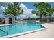 View of a community pool with 3 ft 6 in depth, surrounded by a fenced area with seating at 2110 Churchill Downs Cir, Orlando, FL 32825