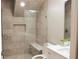 Bathroom with a shower that features decorative tile and a built-in bench at 2112 Waitman, Leesburg, FL 34748