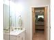 Bathroom with white vanity, green accents, a view of the bedroom, and tile floors at 2112 Waitman, Leesburg, FL 34748