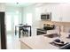 Bright, functional kitchen with stainless steel appliances and adjacent dining area at 2112 Waitman, Leesburg, FL 34748