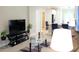 Comfortable living area with modern decor, seamlessly blending into the open kitchen at 2112 Waitman, Leesburg, FL 34748