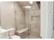 Modern bathroom features a glass-enclosed shower with tiled walls and built-in bench seating at 2114 Waitman Ave Waitman, Leesburg, FL 34748