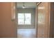 Neutral-toned bedroom featuring a closet and a large window overlooking the backyard at 2114 Waitman Ave Waitman, Leesburg, FL 34748