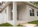 Exterior side view of a home featuring a covered porch and large windows at 2114 Waitman Ave Waitman, Leesburg, FL 34748