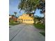 Inviting two-story home with attached two-car garage and well-manicured lawn at 2122 Waseca Ln, Leesburg, FL 34748