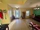 Welcoming foyer featuring tile flooring, neutral wall paint, and abundant natural light at 2122 Waseca Ln, Leesburg, FL 34748