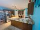 Well-equipped kitchen boasting granite countertops, stainless steel appliances, and ample cabinet space at 2122 Waseca Ln, Leesburg, FL 34748