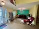 Comfortable living room showcasing tile floors, neutral paint and ample space for furniture at 2122 Waseca Ln, Leesburg, FL 34748