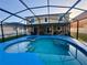 Screened-in pool area with spacious patio, perfect for outdoor entertaining at 2122 Waseca Ln, Leesburg, FL 34748