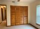 Bedroom featuring a closet and a window at 2530 Shady Ln, Groveland, FL 34736