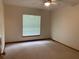 Bedroom featuring a window and carpeted floors at 2530 Shady Ln, Groveland, FL 34736