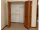 Bedroom closet with paneled doors and wire shelving at 2530 Shady Ln, Groveland, FL 34736