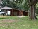 Spacious barn with covered parking provides functionality and storage for vehicles at 2530 Shady Ln, Groveland, FL 34736