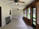 Enclosed patio with two ceiling fans and plenty of natural light at 2530 Shady Ln, Groveland, FL 34736