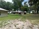 Expansive land showcases multiple outbuildings, offering diverse functionality and space at 2530 Shady Ln, Groveland, FL 34736