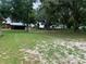 Expansive land showcases multiple outbuildings, offering diverse functionality and space at 2530 Shady Ln, Groveland, FL 34736