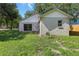 Back of house showcasing sliding glass door that leads to back yard at 2708 Lorraine Dr, Leesburg, FL 34748
