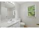 Simple bathroom features a single sink vanity, toilet, and shower-tub combination at 2708 Lorraine Dr, Leesburg, FL 34748