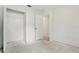 Bright bedroom features an open closet and doorway with concrete floors ready for renovation at 2708 Lorraine Dr, Leesburg, FL 34748