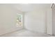 A bedroom features a window and closet doors at 2708 Lorraine Dr, Leesburg, FL 34748