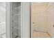 A storage area featuring a closet and an open shelving unit at 2708 Lorraine Dr, Leesburg, FL 34748