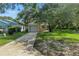 Charming single-Gathering home featuring a well-maintained lawn and mature trees at 2708 Lorraine Dr, Leesburg, FL 34748