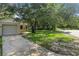 View of the front of the house with a driveway and a lawn at 2708 Lorraine Dr, Leesburg, FL 34748