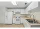 Clean kitchen equipped with essential appliances and ample counter space at 2708 Lorraine Dr, Leesburg, FL 34748