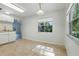 Eat-in kitchen offering ample sunlight, white cabinetry, and smooth countertops at 2708 Lorraine Dr, Leesburg, FL 34748