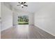 Bright living room with vaulted ceilings and sliding glass doors to the backyard at 2708 Lorraine Dr, Leesburg, FL 34748