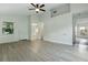 Open-concept living room showcasing modern flooring and seamless flow to other rooms at 2708 Lorraine Dr, Leesburg, FL 34748