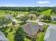 Aerial view of the home showcasing its landscaped yard and neighborhood at 2881 Manor Downs, The Villages, FL 32162