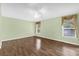 Light and airy bedroom with hardwood floors and large windows at 2881 Manor Downs, The Villages, FL 32162