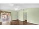 Spacious bedroom with a ceiling fan and large sliding glass doors to the backyard at 2881 Manor Downs, The Villages, FL 32162