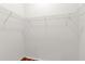Empty walk-in closet with wire shelves at 2881 Manor Downs, The Villages, FL 32162