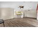 Spacious living room with open layout and wood-look flooring at 2881 Manor Downs, The Villages, FL 32162