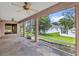 Screened-in patio with stone flooring, offering outdoor living space at 2881 Manor Downs, The Villages, FL 32162