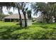View of fenced backyard with lush landscaping, creating a private outdoor oasis at 31104 Fairvista Dr, Tavares, FL 32778