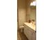 Functional bathroom with a single sink vanity, toilet, and tile flooring for easy maintenance and practical use at 31104 Fairvista Dr, Tavares, FL 32778
