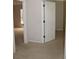 Bedroom doorway showcasing carpet and doorway leading to other parts of the home at 31104 Fairvista Dr, Tavares, FL 32778