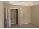 Cozy bedroom featuring built-in closet space for organized storage, complemented by a neutral color scheme for a peaceful ambiance at 31104 Fairvista Dr, Tavares, FL 32778
