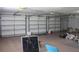 Large garage interior with three bays and ample storage space at 31104 Fairvista Dr, Tavares, FL 32778